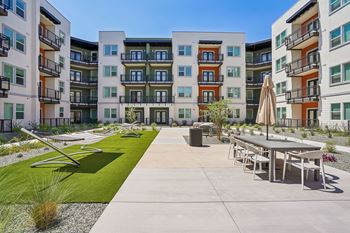 Resort-style courtyard with hammock lounge